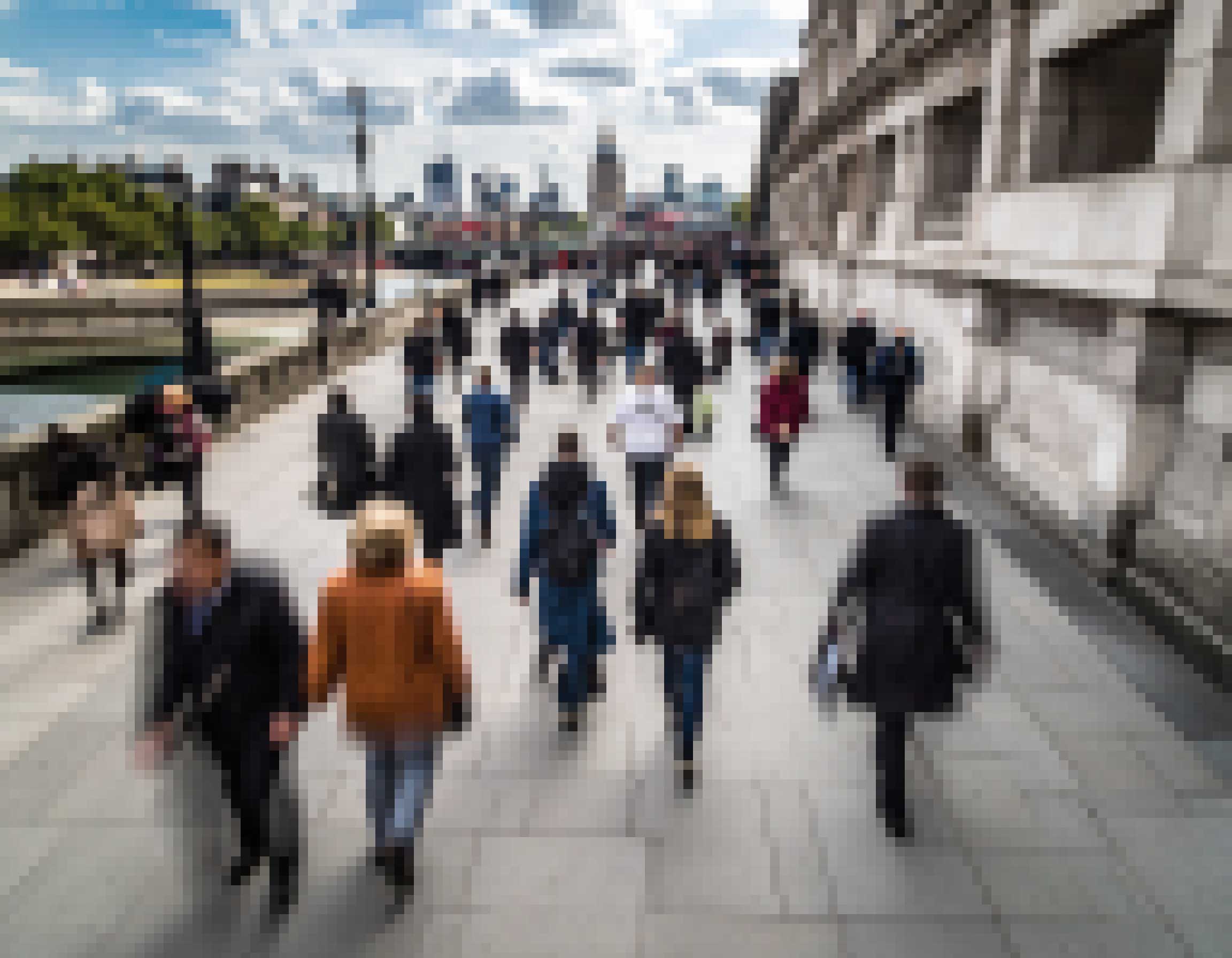 A pixelated photograph of people walking at speed on a London street.