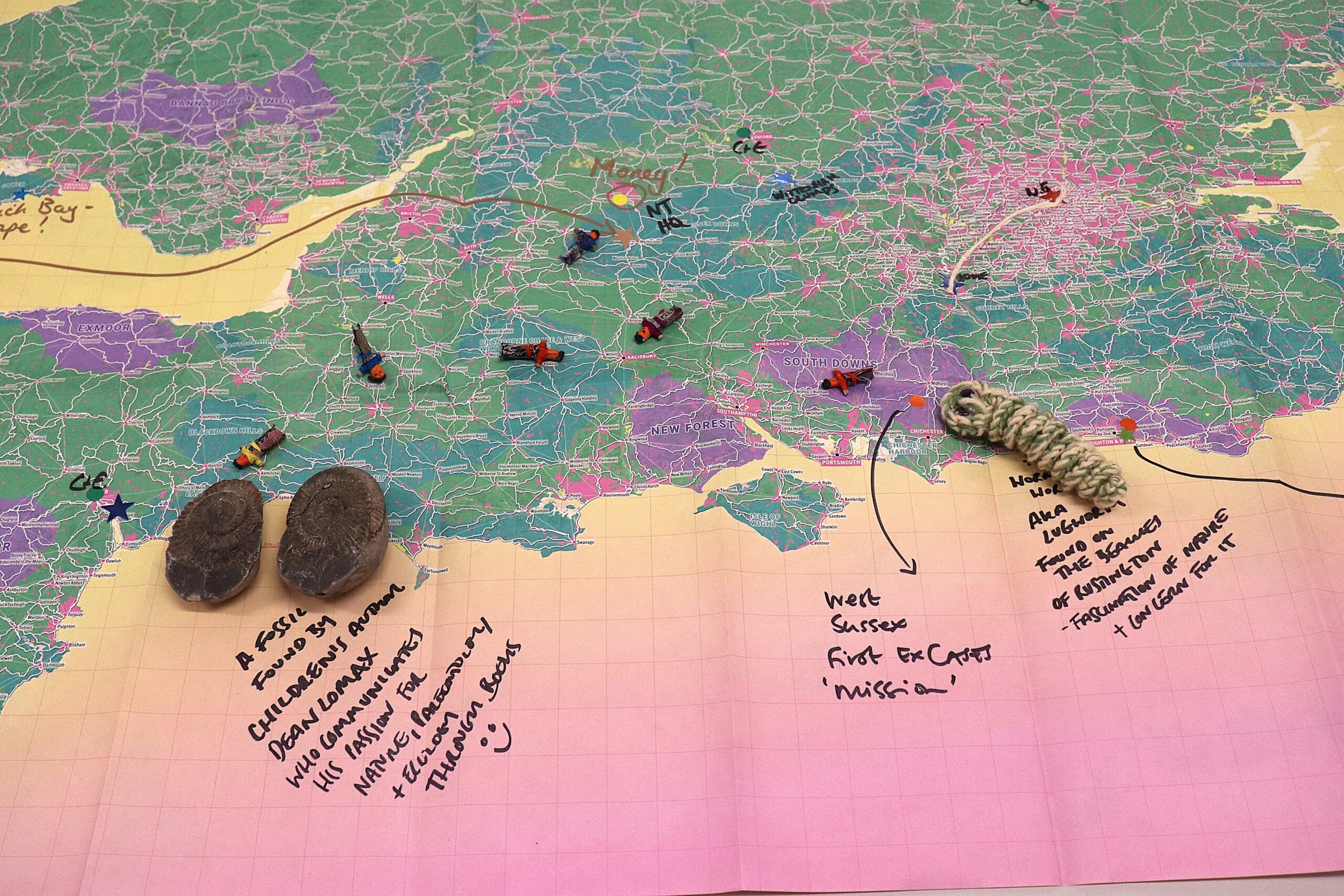 A photograph of a Slow-Ways map that was used as part of Collaboration in Practice workshops. There are annotations to the map such as where a researcher found a fossil or where RENEW's collaborative research began.