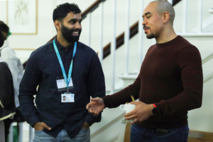 An image of Kiran Sunil and Illustrator Uncle Brow Brows talking at the RENEW X BookTrust Biodiversity Storytelling Summit.