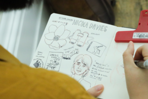 A picture of Jackie Wong taking visual notes at the Biodiversity Storytelling Summit.