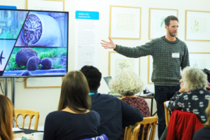 A picture of David Bavin presenting his work.