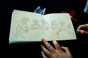 A picture of illustrator Jackie Wong documenting the event in pictures.