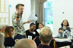 A picture of Caleb Parkin speaking at a workshop at the RENEW x BookTrust Biodiversity Storytelling Summit.