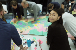 A photograph of Anqi Liu taking part in a workshop