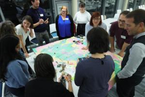 A photograph of a group of people working to resolve a problem