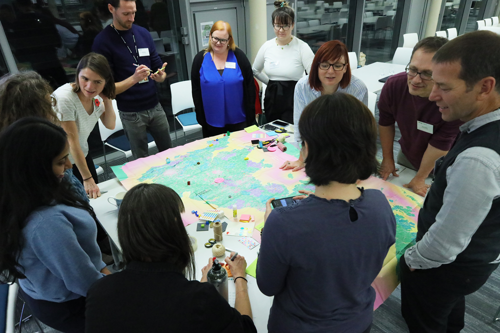 A photograph of a group of people working to resolve a problem