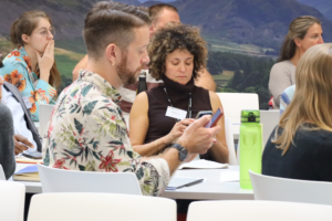 An image of Caleb Parkin and Michelle Twena amongst other members of the Biodiversity Parliament 2023.