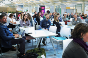 An image of a group of researchers and academics from the National Trust and University of Exeter at the Biodiversity Parliament 2023.