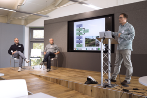 An image of David Baker, Ilya Maclean and Charles Masqualier at the Biodiversity Parliament 2023.