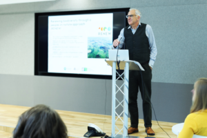 An image of Kevin Gaston delivering a speech.