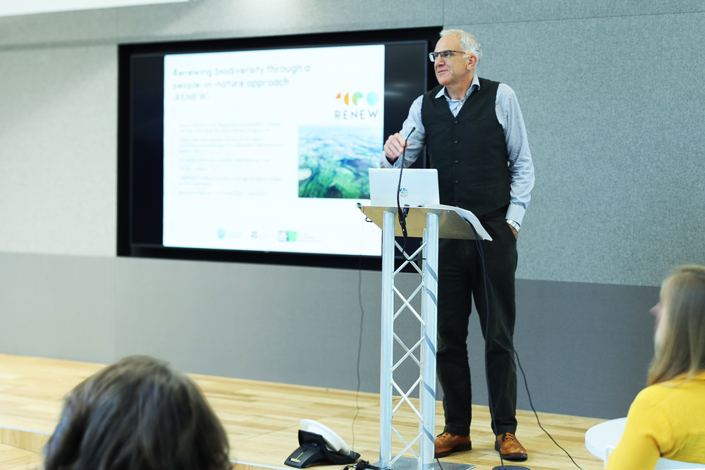 An image of Kevin Gaston delivering a speech.