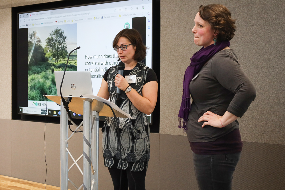 An image of researchers Jo Garret and Rebecca Lovell presenting their research.